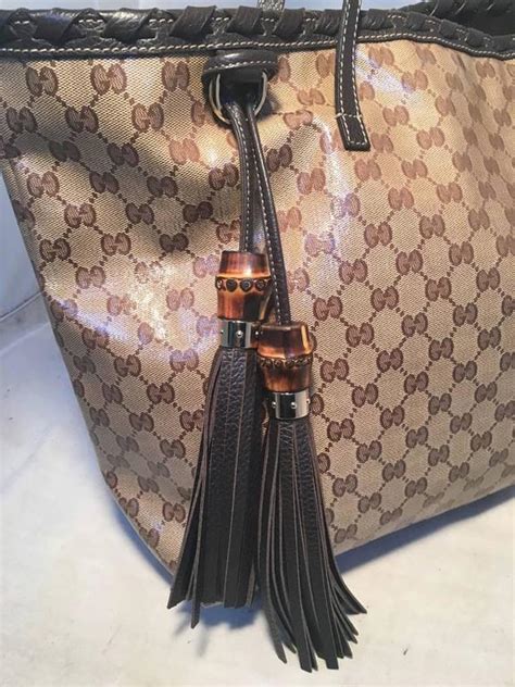 gucci coated monogram double chain handle with tassel handbag large|famous Gucci handbags.